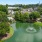 a river with houses and trees