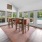 a dining room with a rug