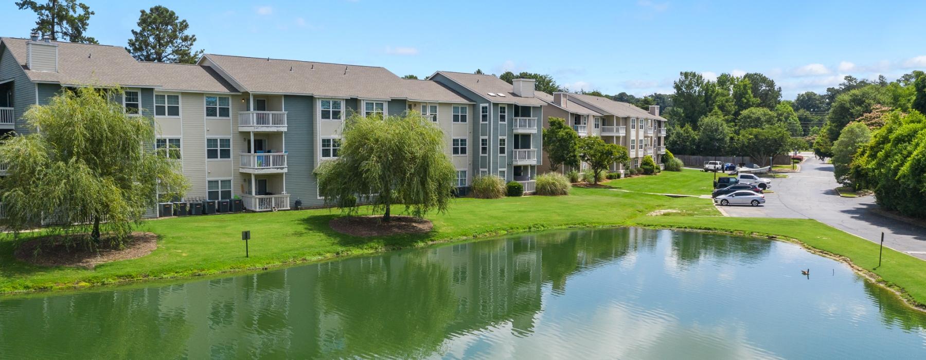 a building with a pond in front of it