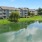 a building with a pond in front of it
