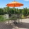 a patio with tables and chairs and umbrellas