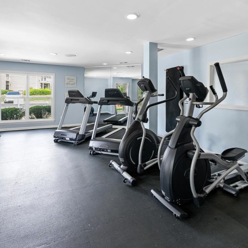 Cutting-edge amenities at your fingertips a room with exercise equipment
